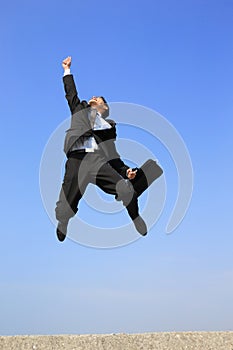 Happy business man jump