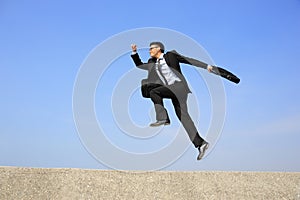 Happy business man jump