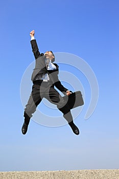 Happy business man jump