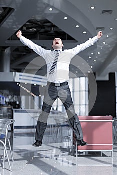 Happy business man jumping