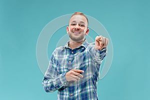 The happy business man point you and want you, half length closeup portrait on pink background.