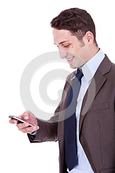 Happy business man reading an SMS