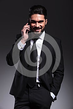Happy business man talking on the phone