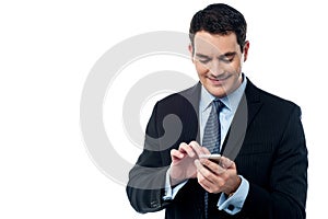 Happy business man using his mobile phone