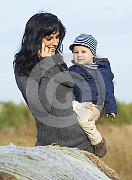 Happy business mother with little boy