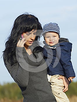 Happy business mother with little boy