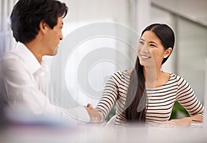 Happy, business people and handshake with colleague for agreement, meeting or deal together at the office. Man and woman