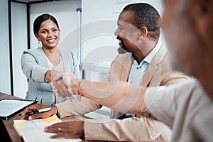 Happy, business people and handshake for meeting, agreement or b2b deal in partnership at the office. Woman employee