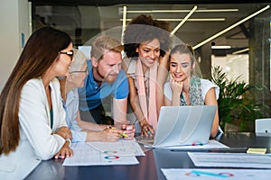 Happy business people, office colleagues having discussion during meeting in conference room.