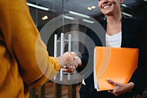 Happy business people partnership handshake meeting concept