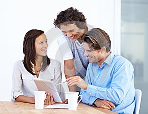 Happy business people, tablet and laughing in meeting for funny joke or meme together at office desk. Group of friendly