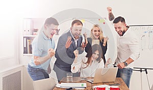 Happy business people team celebrate success in the office