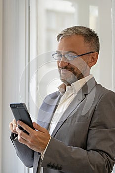 Happy Business Person Touching Screen of His Smart Phone