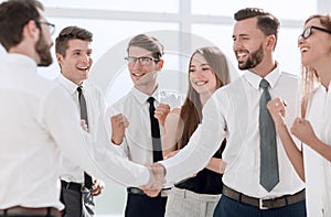 Happy business team looking for a handshake of business partners