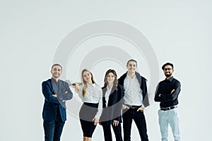 Happy business team smiling isolated over a white background