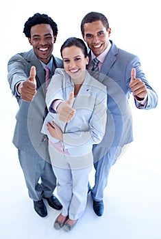 Happy business team with thumbs up