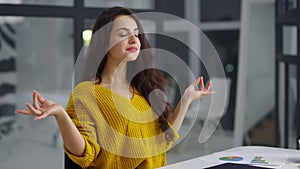 Happy business woman finishing work on laptop. Pretty girl closing computer