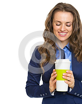 Happy business woman holding cup of hot beverage