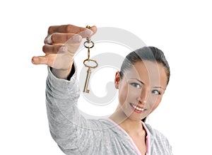 Happy business woman holding keys on white
