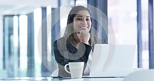 Happy business woman, laptop and coffee at office for morning by window in career ambition or success. Portrait of young