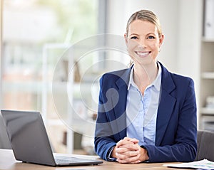 Happy business woman, laptop and smile in success for corporate management at an office desk in the workplace. Portrait