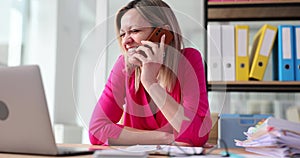 Happy business woman making a phone call and laughing for joke and having funny conversation or communication in office