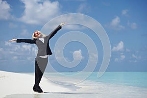 Happy business woman on the ocean coast