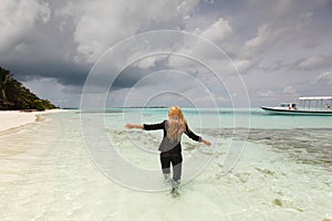 Happy business woman on the ocean coast