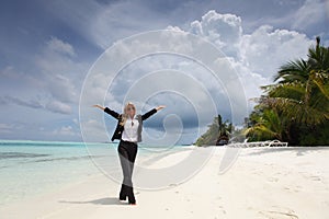 Happy business woman on the ocean coast