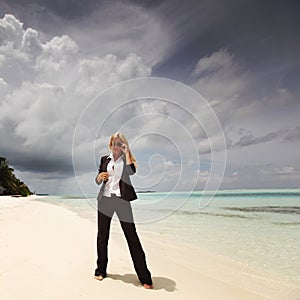 Happy business woman on the ocean coast