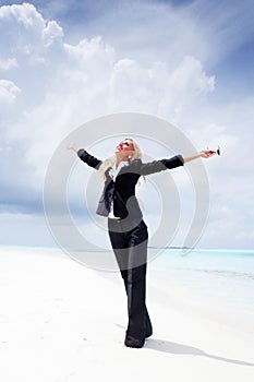 Happy business woman on the ocean coast