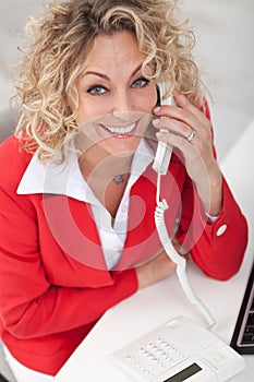 Happy business woman on the phone