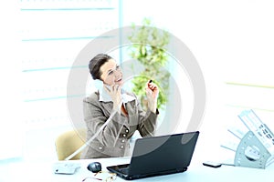 Happy business woman on phone call at office