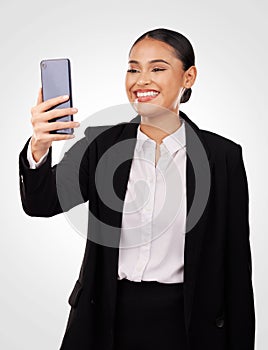 Happy business woman, phone and video call in discussion, networking or communication against a studio background