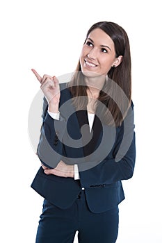 Happy business woman is pointing with forefinger isolated on white. photo