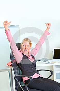 Happy business woman rejoicing success