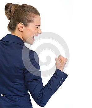 Happy business woman showing fist pump gesture