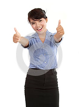 Happy business woman showing her thumbs up