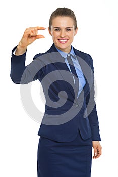 Happy business woman showing little risks