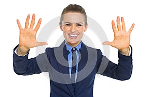 Happy business woman showing palms