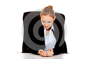 Happy business woman sitting behind the desk