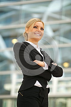 Happy business woman smiling in the city