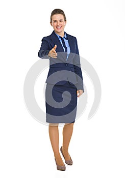 Happy business woman stretching hand for handshake