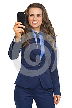 Happy business woman taking photo with phone
