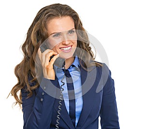 Happy business woman talking phone