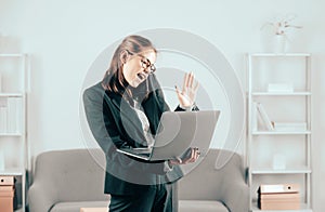 Happy business woman talking on the phone in the office. Portrait of young businesswoman accountant in formal wear at