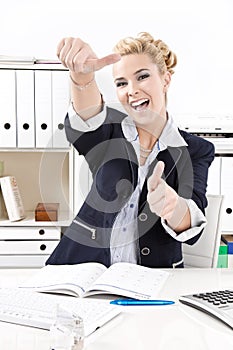 Happy business woman thumbs up