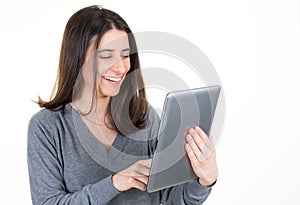 Happy business woman using tablet computer over white background business working girl smiling with copy space