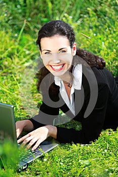 Happy business woman working with notebook