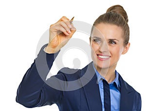 Happy business woman writing in air